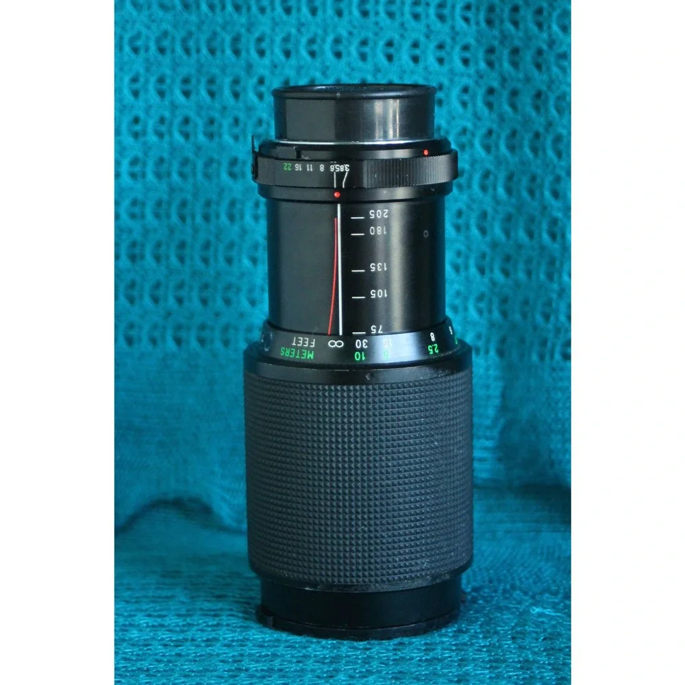 Vivitar 75-205 MM F1:3.8 Lens for Minolta MC mount with 2x converter.